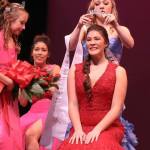 Miss Poulsbo Caroline Atkins receives her title crown from her predecessor, Kaitlyn Morrell. Olympic Photo Group