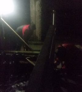 Brownsville Marina crew members and volunteers battled below freezing temperatures and 30-plus mph wind gusts as they worked to rescue the metal bridge that connects the marina&rsquo;s north and east breakwaters, late Jan. 10. (Terryl Asla/Kitsap News Group)