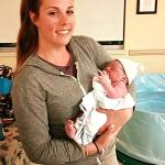 Ellen Yates Barnard with the baby of one of her doula clients.                                Photo courtesy Ellen Yates Barnard