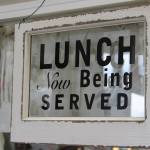 Antique, vintage and retro objects are increasingly in vogue because they help tell our story. And, some stuff, like this window sign at Re-Noun on Viking Avenue in Poulsbo, is just really cool. (Richard Walker/Kitsap News Group)