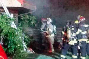 70-year-old log home saved, but couple displaced