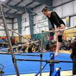 Annelise Pardee prepares to perform a front hip circle on the low bar during the team&rsquo;s Port Angeles quad meet Jan. 16. Sheila Moore / Submitted