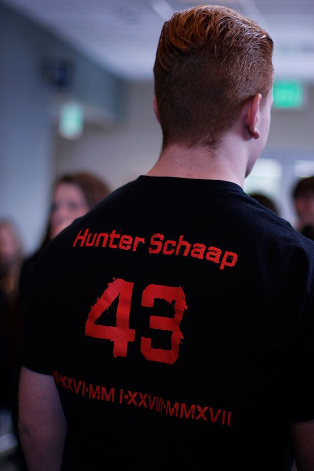 Ryan Brooks wears a T-shirts honoring Hunter Schaap, Feb. 7 at GracePoint Church in Bremerton. Sophie Bonomi / Kitsap News Group