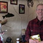 Chip Hanauer pays a visit to Crimson Cove in downtown Poulsbo during an earlier Winter Rendezvous. Hanauer, one of the most successful hydroplane racers in that sport&rsquo;s history, now hosts an online program, &ldquo;The Boat Guy,&rdquo; to promote boating and boating communities. He is the organizer of the Winter Rendezvous. Looking on is Elaina Trostad, an employee of Crimson Cove at the time. Photo: The Boat Guy/Courtesy