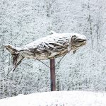 Snow covers the large driftwood fish sculpture at Poulsbo&rsquo;s Fish Park, Feb. 6. (Sophie Bonomi / Kitsap Daily News)