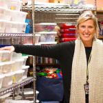 Gordon Elementary librarian Sheila Fagan-Trunkey stands in front of the school&rsquo;s STEM section at the library. Shelves of materials &mdash; from PlayDoh to &ldquo;Bee Bots,&rdquo; are available to help students make connections between science and creativity. (Sophie Bonomi / Kitsap News Group)