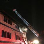 Firefighters extinguish a fire on the top floor of the Blue Water Inn annex, Feb. 9. (Michele Laboda/North Kitsap Fire & Rescue)