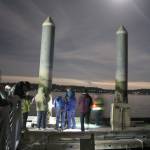 Adults examine the sea life on pier pilings while flashlights illuminate the underwater sides of the floating of the floating concrete docks.                                TerrylAsla/Kitsap News Group
