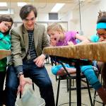 Students test the strength of popsicle bridges built in the 2016 summer STEM camps.                                Courtesy Central Kitsap School District