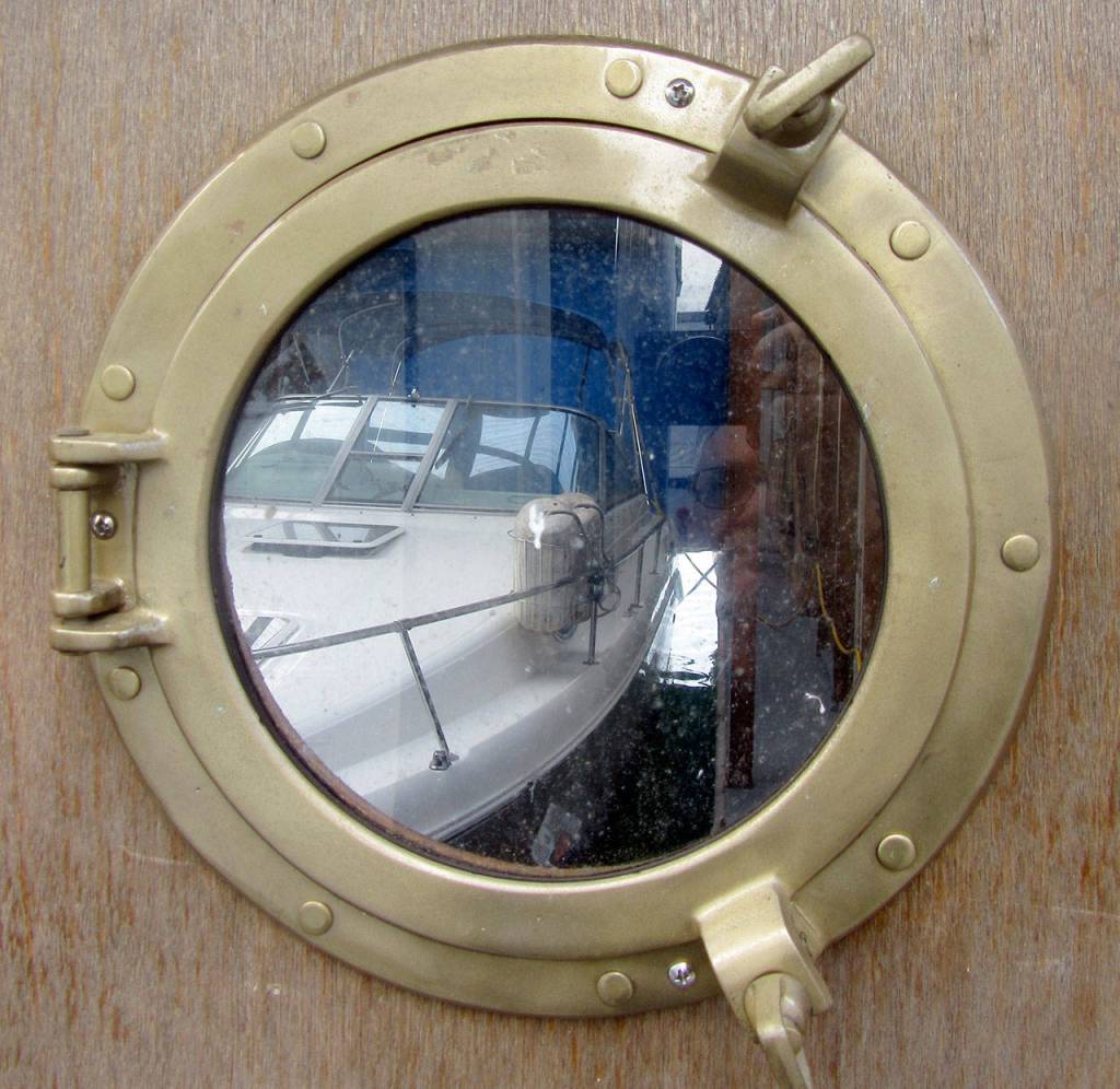 A bronze porthole invites passersby to admire the owner&rsquo;s boat.                                Terryl Asla/Kitsap News Group
