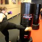 Classes at iLoveKickboxing are high energy, high intensity workouts, which up to about 30 people can participate in at a time. Throughout the classes, instructors go around helping people correct their form and encouraging them to keep pushing.                                Michelle Beahm / Kitsap News Group