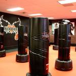 Everybody gets to use a bag during the classes at iLoveKickboxing, giving them resistance to help improve the workout.                                Michelle Beahm / Kitsap News Group