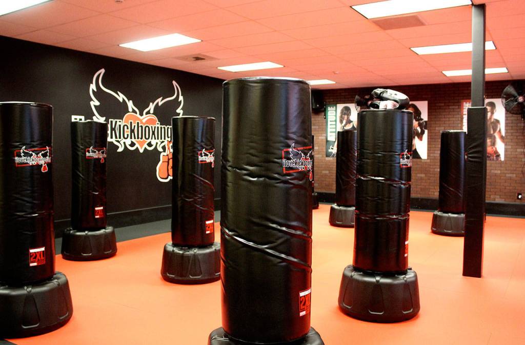 Everybody gets to use a bag during the classes at iLoveKickboxing, giving them resistance to help improve the workout.                                Michelle Beahm / Kitsap News Group