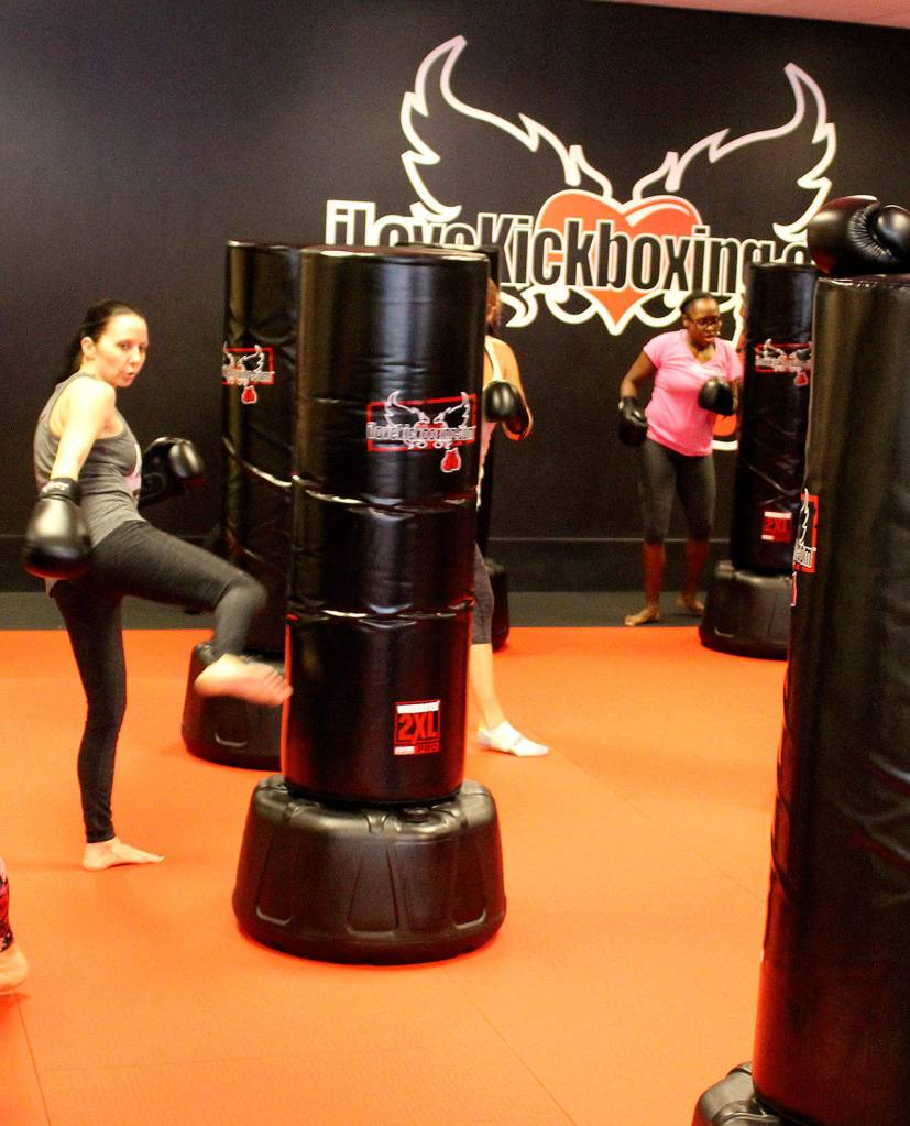 Classes at iLoveKickboxing are high energy, high intensity workouts, which up to about 30 people can participate in at a time. Throughout the classes, instructors go around helping people correct their form and encouraging them to keep pushing.                                Michelle Beahm / Kitsap News Group