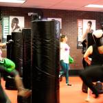 Classes at iLoveKickboxing are high energy, high intensity workouts, which up to about 30 people can participate in at a time. Throughout the classes, instructors go around helping people correct their form and encouraging them to keep pushing.                                Michelle Beahm / Kitsap News Group