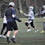 Logan Cole scored the winning goal for North Kitsap lacrosse in the team&rsquo;s 12-11 overtimewin over Klahowya, March 27 at Strawberry Field. (Richard Walker/Kitsap News Group)