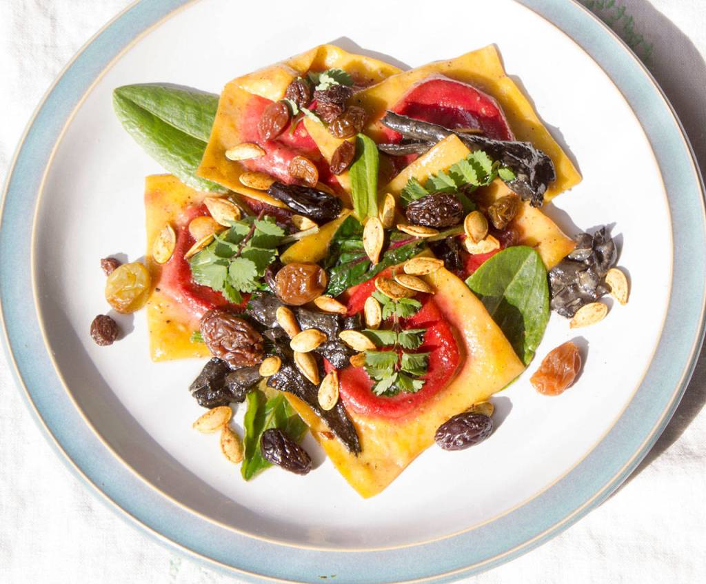 Mossback&rsquo;s ravioli: Fresh pasta stuffed with roasted beetroot, ricotta, black pepper and honey, sauteed in brown butter, topped with sorrel, salad burnet, dill aquavit-soaked raisins, and spiced pumpkin seeds. (Sophie Bonomi / Kitsap News Group)