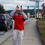 One of the secrets of good sign spinning is to always make sure the arrow is pointing at the business, said Aliki.                                Terryl Asla/Kitsap News Group