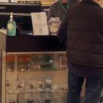 Owner Annette Atkinson helps a customer in the Silverdale HWY 420 store, which opened on April 1. (Terryl Asla/Kitsap News Group)
