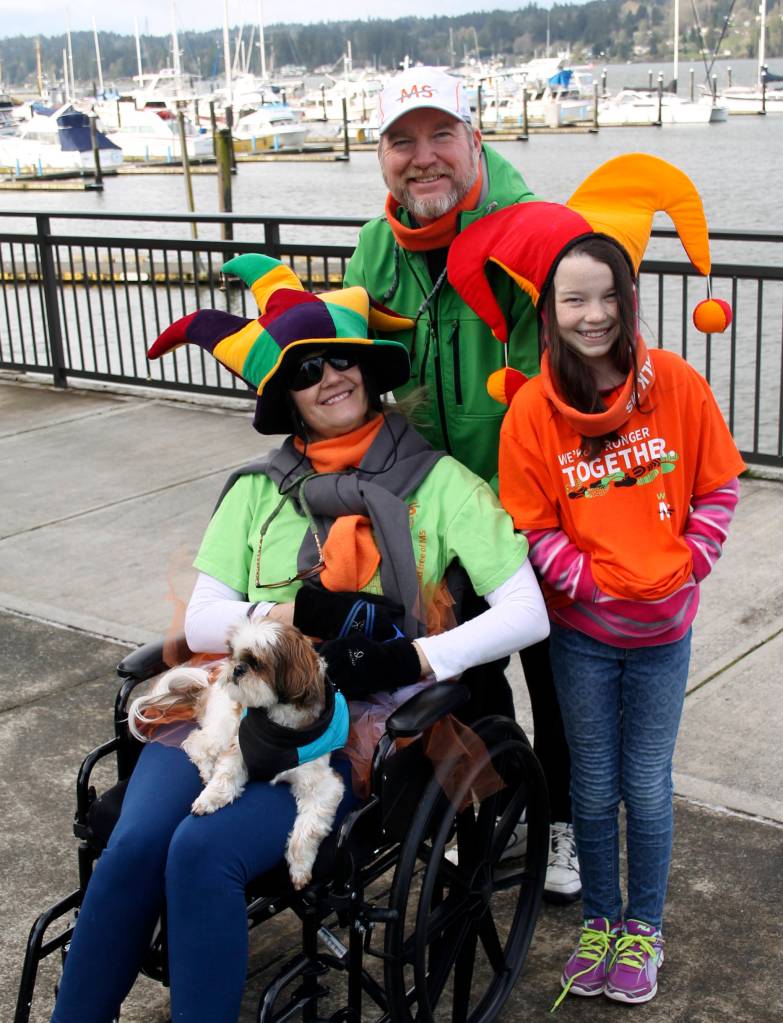 The Plake family wasn&rsquo;t clowning around about fighting MS, but they kept their sense of humor. Jennifer (left), who was diagnosed with MS five years ago, brought along her husband John, daughter Jennifer and Indy the dog. (Terryl Asla/Kitsap News Group)