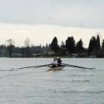 Girls row up to the starting line before their race. From front, Allison Burns, Central Kitsap High School; Robbi Koenen, South Kitsap High School; Addie Talbot, CKHS Running Start; Anna Moore, CKHS. Not visible: Coxswain Elizabeth Simmons, Klahowya, lying down in the bow calling the cadence.  Brooke Organ / Clam Island Rowing Club