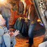 Under the glare of the TV camera light, a seated Ed visits with Rep. Derek Kilmer, D-Bremerton, in the dining room of Ed&rsquo;s home on April 14. (Terryl Asla/Kitsap News Group)