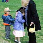 King Leblanc gives a pat on the back to his sister Anaiya Leblanc, 6, who was a bit overwhelmed by the crowds and excitement at the Fathoms O&rsquo; Fun Easter egg hunt at South Kitsap Regional Park April 15.                                Photo: Bob Smith | Kitsap Daily News