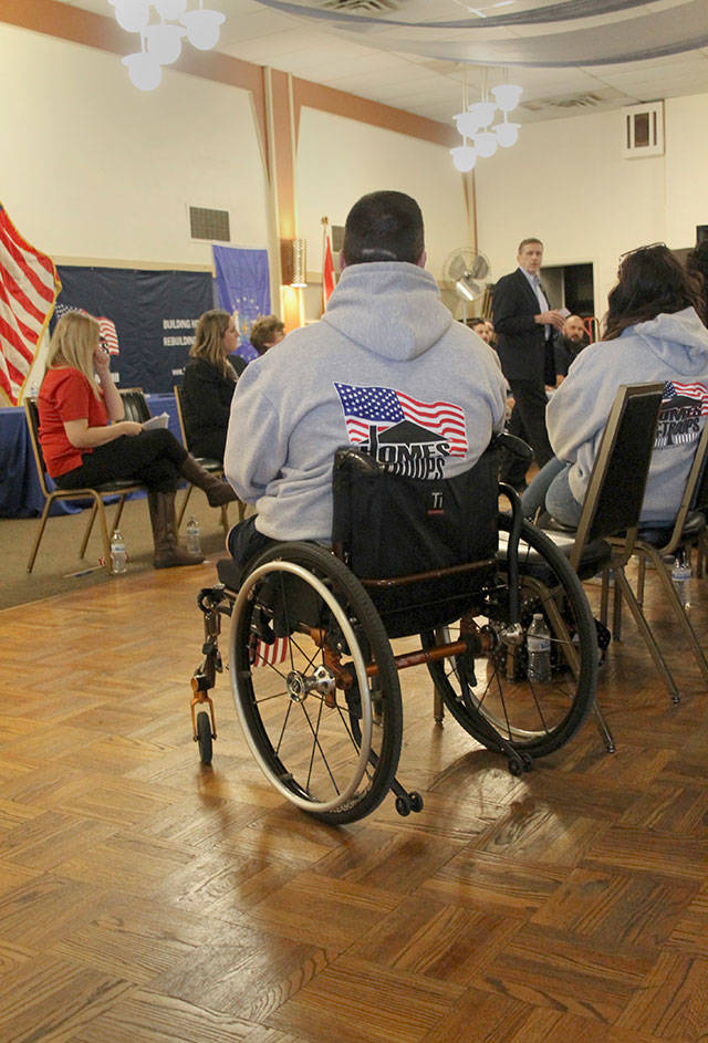 Homes for Our Troops executive director Bill Ivey, center, explains the nonprofit&rsquo;s goals and what local residents can do to help support the program, which has provided more than 200 wounded warriors nationwide with mortgage-free homes designed to meet their special needs. (Terryl Asla/ Kitsap News Group)