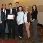 Darek Grant, Superintendent Karst Brandsma, Port Orchard Mayor Rob Putaansuu, Board President Greg Wall, Jane Douglas, Laurie Wagner and Board Vice President Rebecca Diehl are pictured with the WASA Regional Award from South Kitsap School District.                                Photo: South Kitsap School District