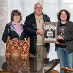 From left, Kathi Foresee and Ron Krell of the Viking Fest Corp. with artist Keith Lyon and Lyon&rsquo;s winning logo for 2017 Viking Fest. Lyon receives the $1,250 Barbara Krell Memorial Scholarship. (P5 Photography)