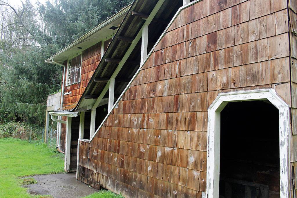 The City of Poulsbo is acquiring 2.68 acres at 20831 Bond Road NE for $1. The property was abandoned and Freddie Mac foreclosed on it. A flood-prone house near Dogfish Creek will be removed and the acreage added to Fish Park. Terryl Asla/Kitsap News Group