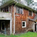 The City of Poulsbo is acquiring 2.68 acres at 20831 Bond Road NE for $1. The property was abandoned and Freddie Mac foreclosed on it. A flood-prone house near Dogfish Creek will be removed and the acreage added to Fish Park. Terryl Asla/Kitsap News Group