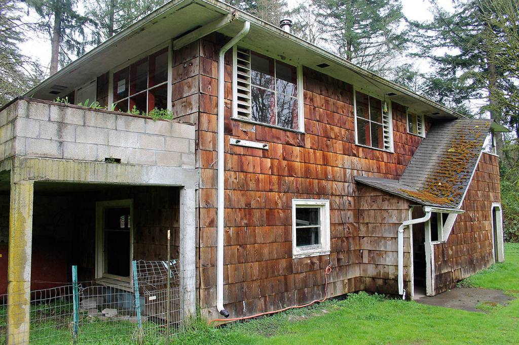 The City of Poulsbo is acquiring 2.68 acres at 20831 Bond Road NE for $1. The property was abandoned and Freddie Mac foreclosed on it. A flood-prone house near Dogfish Creek will be removed and the acreage added to Fish Park. Terryl Asla/Kitsap News Group