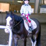 Kira O&rsquo;Malley poses with her ribbons from the Sandamar Farm Winter Series show, April 15. (Sophie Bonomi / Kitsap News Group)