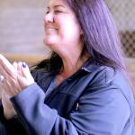 Tracy Patterson applauds competitors during the Sandamar Farm Winter Series show, April 15. (Sophie Bonomi / Kitsap News Group)