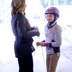 Lisa O&rsquo;Malley helps her daughter, Myla, prepare for her event April 15 at Sandamar Farm. (Sophie Bonomi / Kitsap News Group)