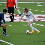 Grant Larson taking on a player during the March 11 game against Graham Kapowsin. Larson scored twice during the game.
