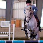 Jada Hertz, 14, and Hugo sail over a 2-foot-9-inch jump during an English event at Sandamar Farm April 15. (Sophie Bonomi / Kitsap Daily News)