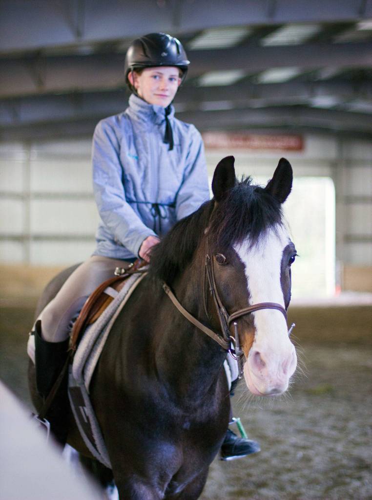 Ava O&rsquo;Malley and her horse confidently enter the arena at the Sandamar Farm Winter Series show, April 15. (Sophie Bonomi / Kitsap News Group)