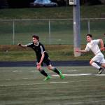 Klahowya and North Kitsap players race for possession March 30. The game ended in a 1-1 tie. Sophie Bonomi/Kitsap News Group