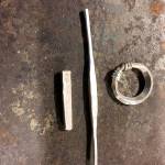 The three stages of silver jewelry making: silver bar, shaped line and finished ring, created by David Meyers, a blacksmith, blade smith and silver smith with the Kingdom of An Tir.                                Photo courtesy David Meyers