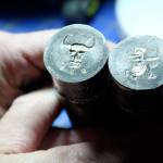 Two coins dyes for opposite sides of a coin, used in hand striking. Arion the Wander uses different tools for the lighter details and for the deeper relief parts of the dye.                                Michelle Beahm / Kitsap News Group