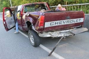 A car and a pickup truck collided shortly before 5 p.m. in the southbound lane of Highway 305, May 22. A Lemolo man said he was driving &ldquo;traffic speed at best&rdquo; but believes he passed out from fatigue and heat. When he came to, he said, his car had crashed into a pickup truck and then a guardrail. (Richard Walker/Kitsap News Group)