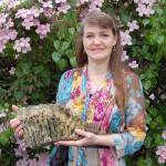 Lori Christie, a managing broker at JACE Real Estate, holds a Columbian mammoth molar she and her boyfriend Dean Flowers discovered while walking along a public beach in Sequim. (Erin Hawkins/Olympic Peninsula News Group)