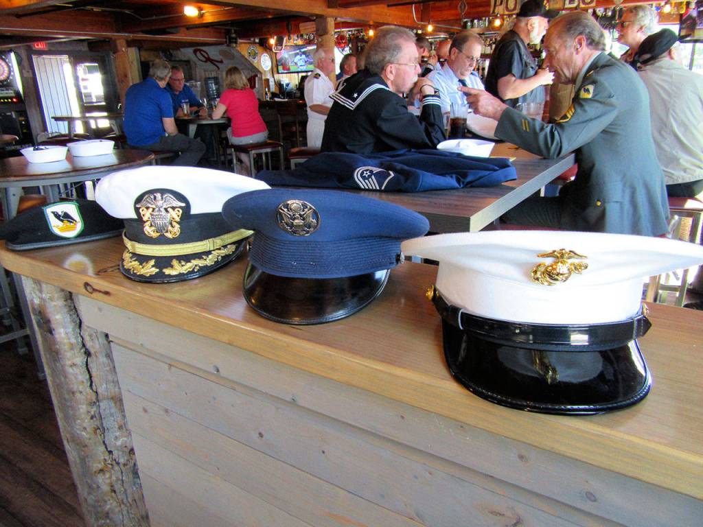 The covers of the four services whose veterans attended this year&rsquo;s pub crawl. Terryl Asla/Kitsap News Group