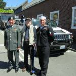 Everybody wanted to have their picture taken with World War II veteran Don Rakers, center. He&rsquo;s flanked by Army veteran Barry Trudeau on the left and EM2 Joe Lewis, USN, on his right. Terryl Asla/Kitsap News Group