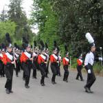 CKHS Marching band, led by drum major Jonathan Madamba, turn the corner, enroute to Principal Coons&rsquo; home. Terryl Asla/Kitsap News Group