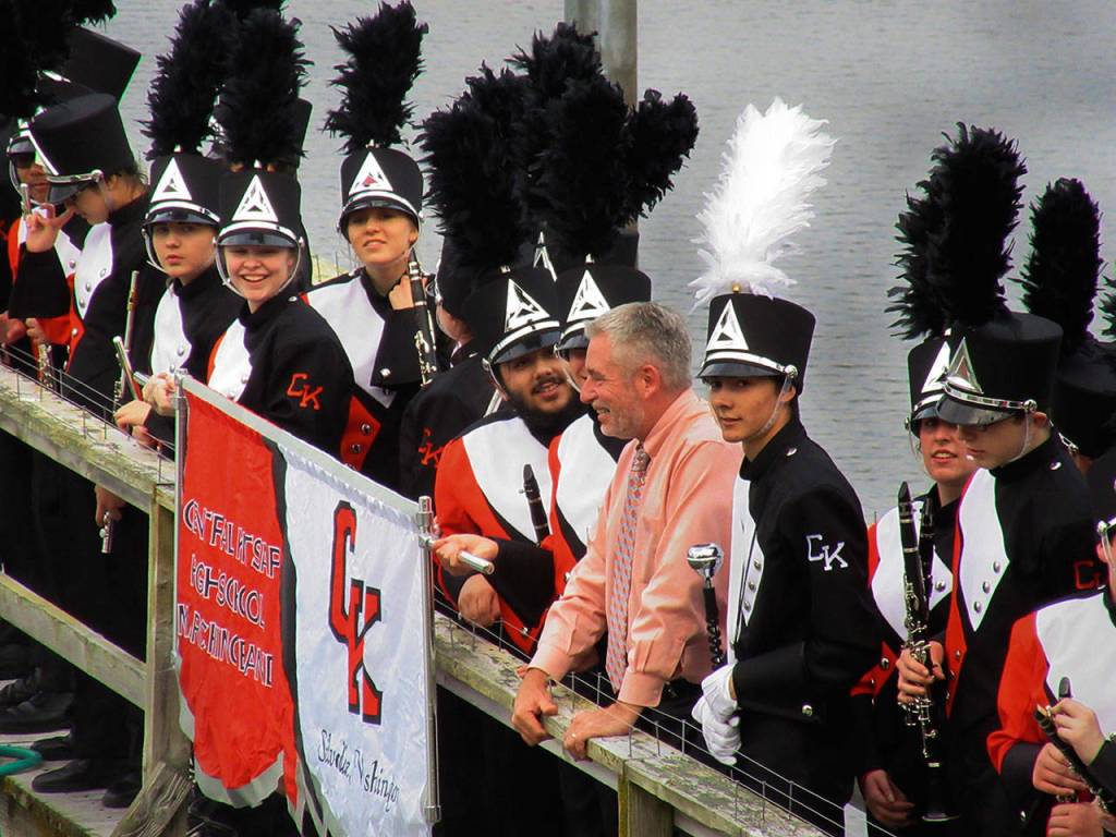 Central Kitsap High School Principal Stephen Coons is greeted by members of the school band on his home&rsquo;s pier, May 18. Terryl Asla / Kitsap News Group