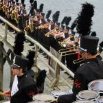 The band performs the school&rsquo;s fight song on the Coons&rsquo; pier, much to the enjoyment of nearby kayakers and fishermen. Terryl Asla/Kitsap News Group