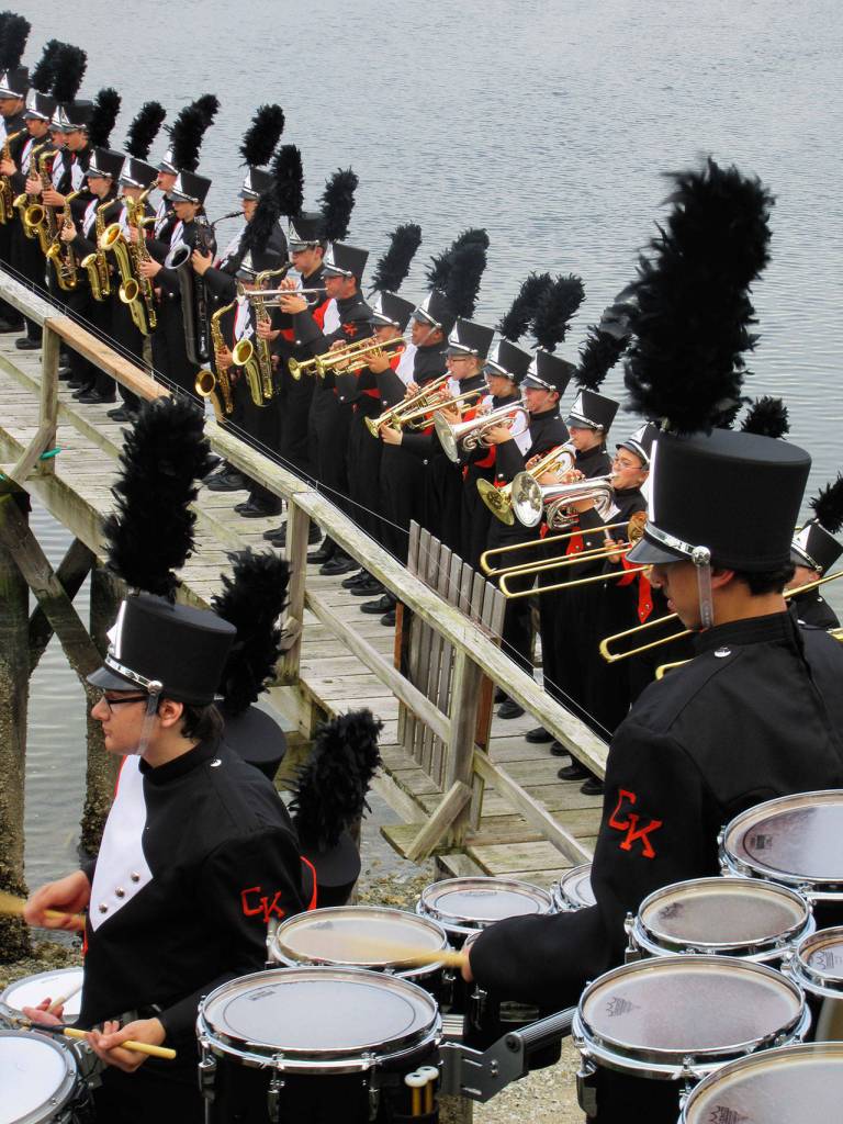 The band performs the school&rsquo;s fight song on the Coons&rsquo; pier, much to the enjoyment of nearby kayakers and fishermen. Terryl Asla/Kitsap News Group
